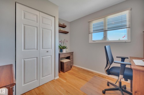 Light wood-finish flooring complements the neutral wall tones - 184 Garwood Cres, Wetaskiwin, AB - Indoor Photo Showing Office