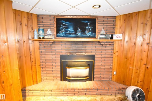 58 Wilson Crescent, Sherwood Park, AB - Indoor Photo Showing Living Room With Fireplace