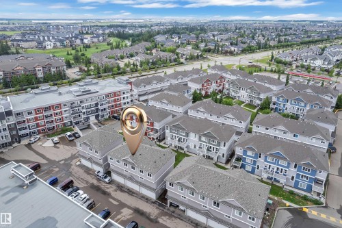 Aerial perspective showcasing a residential development with multiple townhome-style units - 82 1816 Rutherford Road, Edmonton, AB 
