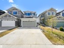 Contemporary residence featuring a light gray exterior with contrasting dark gray accents - 2435 12 Avenue, Edmonton, AB 