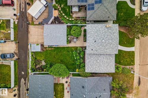 Aerial perspective showcasing a residential property with a shingled roof - 10715 33 Avenue, Edmonton, AB 