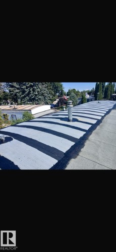 Pitched roof with gray and black roofing material and a single vent pipe - 543 Evergreen Park Northwest, Edmonton, AB - Outdoor With View