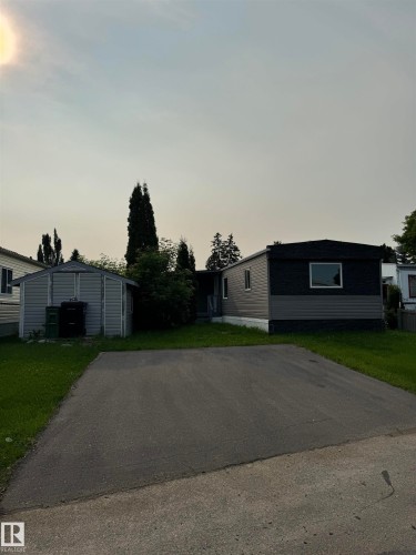 Two-tone exterior with dark gray and light gray siding - 543 Evergreen Street, Edmonton, AB 