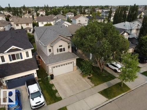 Contemporary two-story residence featuring a gray exterior, attached two-car garage, and a gabled roof - 9 Snowbird Crescent, Leduc, AB - Outdoor