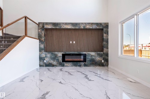 216 33 Street Sw, Edmonton, AB - Indoor Photo Showing Other Room With Fireplace