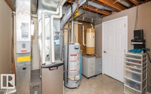 HVAC system, water heater, and water softener in a utility space - 10420 111 Avenue, Westlock, AB 