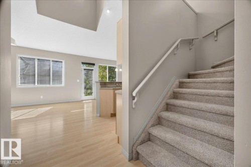 Carpeted staircase with white handrails - 20 4821 Terwillegar Common, Edmonton, AB 