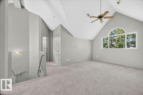 Vaulted ceiling with an arched window and ceiling fan - 20 4821 Terwillegar Common, Edmonton, AB 