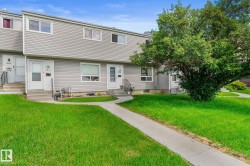 Exterior features gray horizontal siding and white trim - 