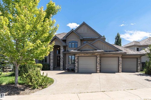Contemporary-style residence featuring a multi-gabled roofline and stone and stucco exterior - 3503 Watson Point(E), Edmonton, AB 