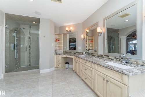 Spacious bathroom featuring an expansive dual vanity with integrated sinks and granite countertops - 3503 Watson Point(E), Edmonton, AB 