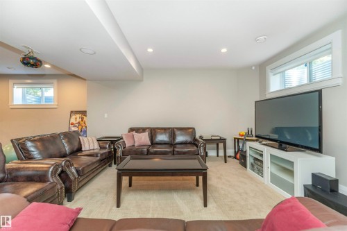 Carpeted living space featuring recessed lighting and a drop ceiling with integrated lighting - 3503 Watson Point(E), Edmonton, AB 