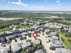 Aerial view of a residential neighborhood with varied architectural styles and mature landscaping - 