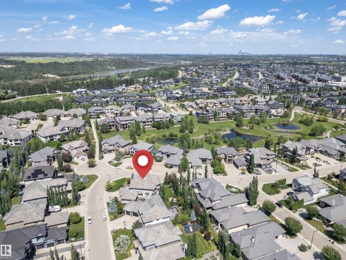 Aerial perspective of a residential community featuring diverse housing styles, mature trees, and a curvilinear street layout - 3503 Watson Point(E), Edmonton, AB 