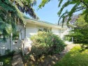 White siding exterior with mature landscaping - 5012 143 Street, Edmonton, AB 