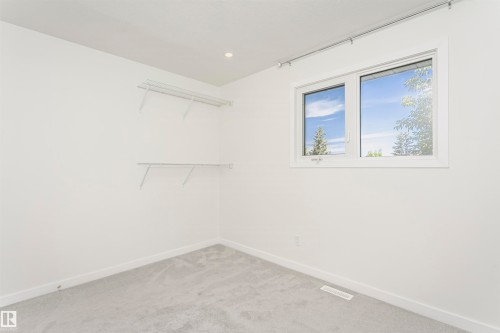 White interior walls with gray carpeting - 17716 84 Avenue, Edmonton, AB 