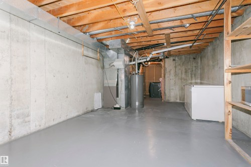 Concrete foundation walls with exposed wood ceiling joists - 17716 84 Avenue, Edmonton, AB 