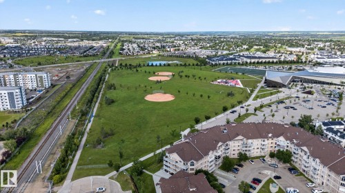 Expansive green spaces featuring multiple baseball diamonds and recreational facilities - 140 301 Clareview Station Drive, Edmonton, AB 