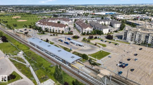 Aerial perspective showcasing a modern train station with multiple tracks and covered platforms - 140 301 Clareview Station Drive, Edmonton, AB 