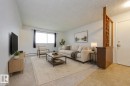 Unit 2 Living Room. This image is virtually staged. - 3811 116 Avenue, Edmonton, AB 