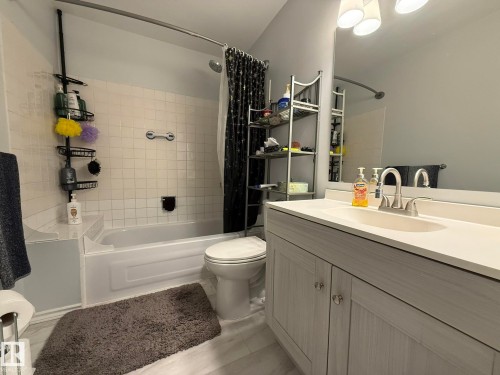 Another Photo of the UPPER FLOOR FULL 4pc Bathroom featuring a single vanity with light-toned cabinetry and a white countertop with an integrated sink - 166 Roseland Village, Edmonton, AB - Indoor Photo Showing Bathroom