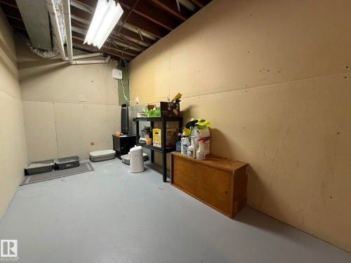 PHOTO OF THE EXTRA BASEMENT STORAGE ROOM NEXT TO THE FURNACE & HWT! - 166 Roseland Village, Edmonton, AB - Indoor Photo Showing Basement