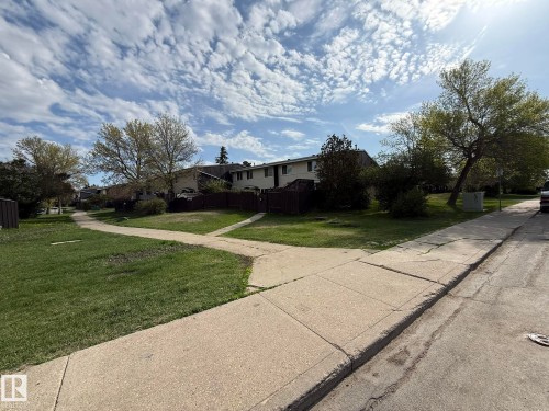 USE THIS SIDEWALK ON THE BACK LEFT OF YOUR UNIT #166 TO GET TO YOUR #90 PARKING STALL! - 166 Roseland Village, Edmonton, AB - Outdoor