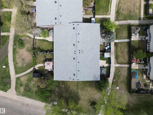 Residential property featuring a grey shingle roof and multiple skylights - 166 Roseland Village, Edmonton, AB - Outdoor