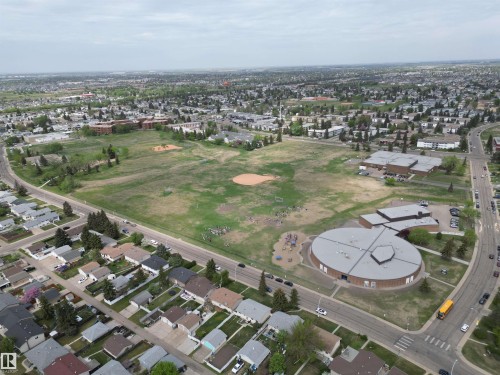 Expansive neighborhood featuring numerous residential properties with mature landscaping and established infrastructure - 166 Roseland Village, Edmonton, AB -  With View