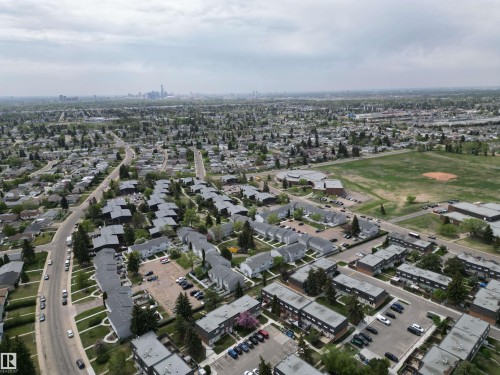 Aerial perspective showcasing varied residential architecture including single-family homes and multi-unit complexes - 166 Roseland Village, Edmonton, AB - Outdoor With View