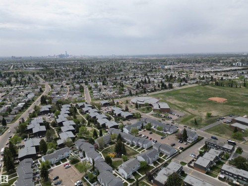 Expansive aerial perspective showcasing a residential neighborhood with varied housing styles - 166 Roseland Village, Edmonton, AB - Outdoor With View