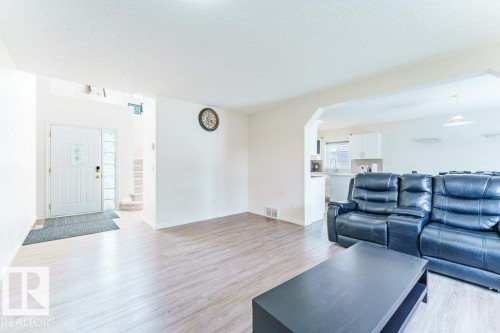 Open concept living space featuring light wood-finish flooring - 3525 22 Street, Edmonton, AB - Indoor Photo Showing Living Room