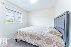 Room with light-toned walls, a double window with blinds, and recessed ceiling lighting - 