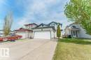 Siding exterior with a double garage, concrete driveway, and front lawn - 3525 22 Street, Edmonton, AB  - Outdoor With Facade 