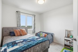Bright room featuring light gray carpet flooring and white walls - 
