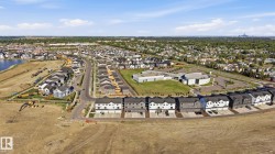 Aerial perspective of a developing residential community featuring a variety of housing styles - 