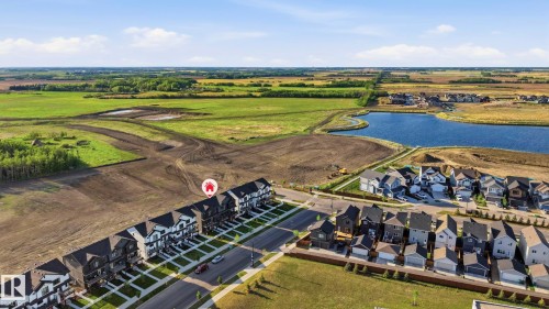 Aerial perspective showcasing a developing community with varied housing styles - 58 Jensen Gate, St. Albert, AB 