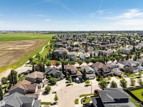 Residential property situated within a suburban neighborhood, featuring a dark gray roof - 9 Shorewood Crescent, Leduc, AB - Outdoor With View