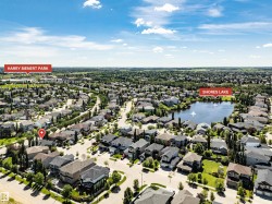 Aerial perspective showcasing a residential neighborhood with Shores Lake and Harry Bienert Park - 