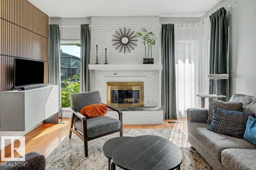 30 Adamic Crescent, Leduc, AB - Indoor Photo Showing Living Room With Fireplace