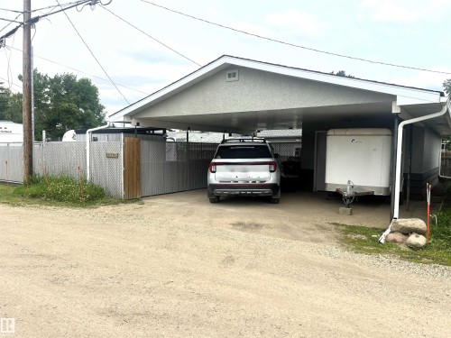 Carport providing covered parking - 4812 47 St, Drayton Valley, AB 