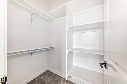 Walk in closet - 14 Tenuto Link, Spruce Grove, AB - Indoor With Storage