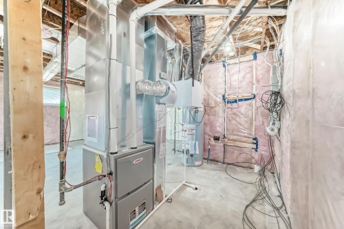 Lennox HVAC system, water heater, and exposed ceiling joists - 14 Tenuto Link, Spruce Grove, AB - Indoor Photo Showing Bathroom