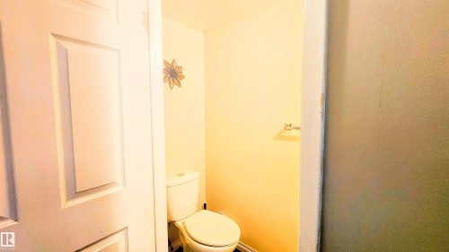 Bathroom with toilet - 704 Abbottsfield Road, Edmonton, AB - Indoor Photo Showing Bathroom