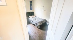 Bedroom with wood finished floors - 