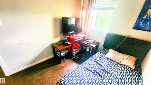 Bedroom with baseboards and wood finished floors - 704 Abbottsfield Road, Edmonton, AB - Indoor