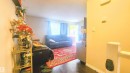 Living area featuring dark wood-style flooring and baseboards - 704 Abbottsfield Road, Edmonton, AB  - Indoor Photo Showing Other Room 