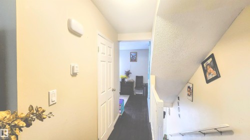 Corridor with dark wood-type flooring - 704 Abbottsfield Road, Edmonton, AB - Indoor Photo Showing Other Room