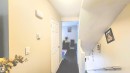 Corridor with dark wood-type flooring - 704 Abbottsfield Road, Edmonton, AB  - Indoor Photo Showing Other Room 