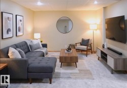 Virtually staged basement family room. - 